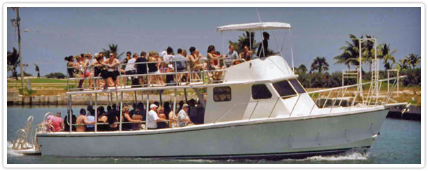 Small touring vessel preparing to dock