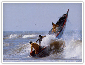 Wave crashing into a small boat